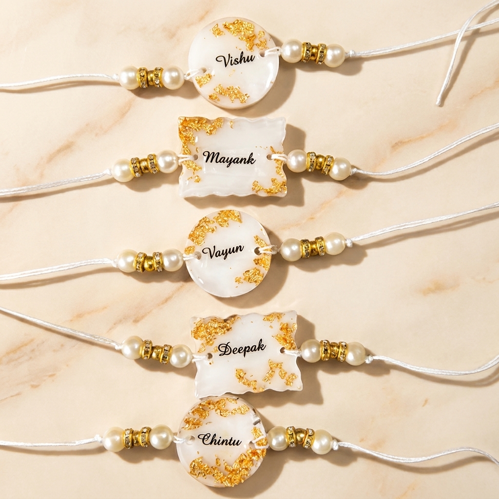 Handmade Personalized Resin Rakhi with custom name, pearl beads and gold foil detailing by CanvasByPriya